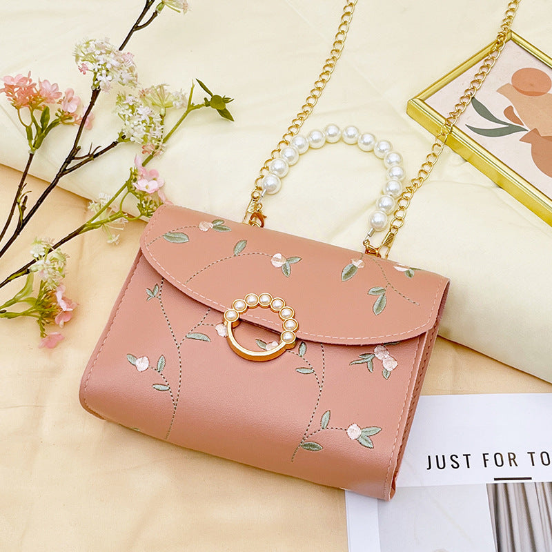 Wholesale bag with embroidered pearls and magnetic buckle chain